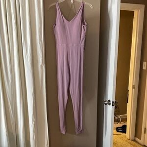 Purple Skinny Jumpsuit with V-neckline and Fitted Silhouette - Never Worn